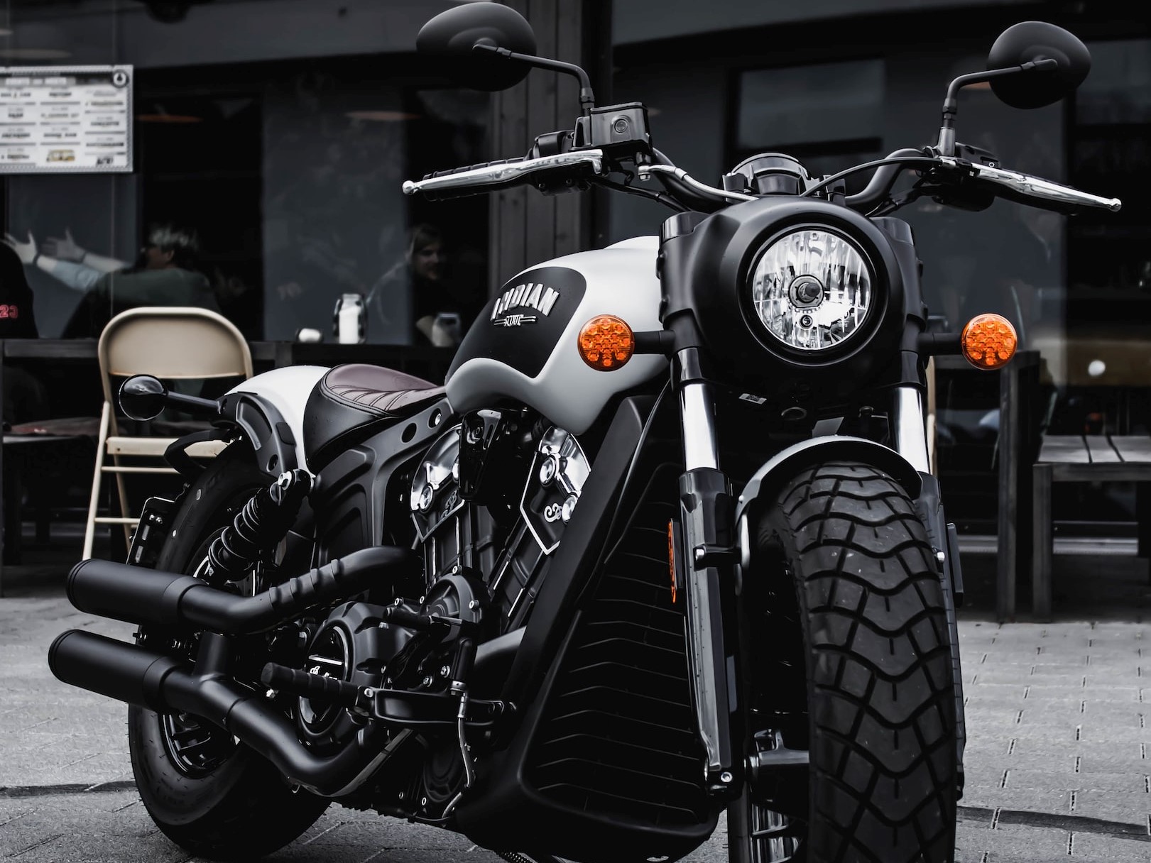 black and gray cruiser motorcycle parked beside black concrete | Veteran Car Donations