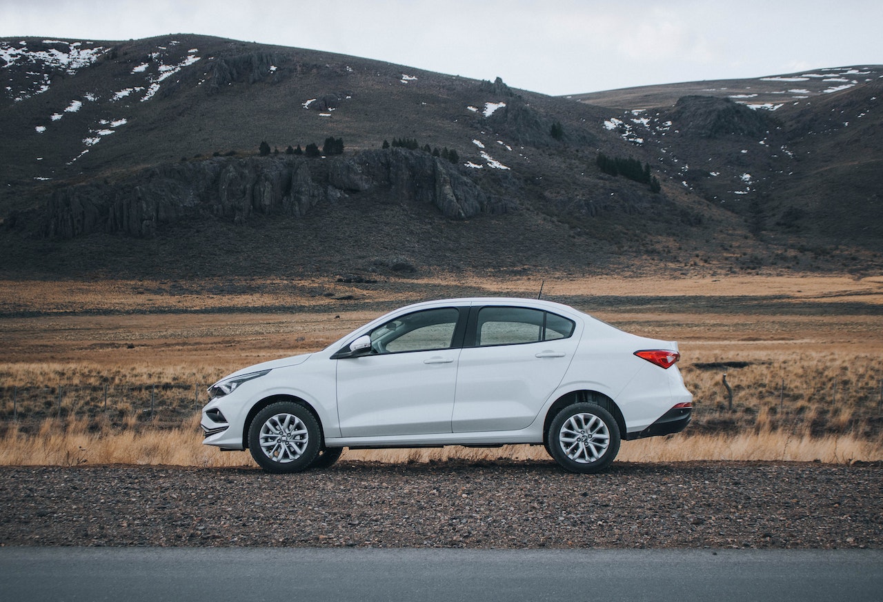 A white sedan on the roadside | Veteran Car Donations