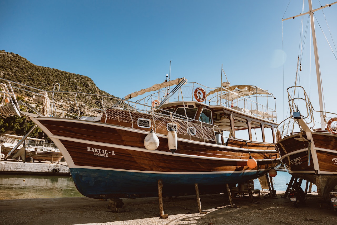 Fishingboats docked on beach | Veteran Car Donations