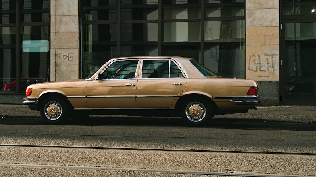 Gold Mercedes Benz Parked on Gray Concrete Road | Veteran Car Donations