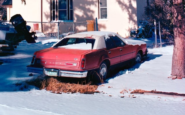 Red Old Car in Snow | Veteran Car Donations
