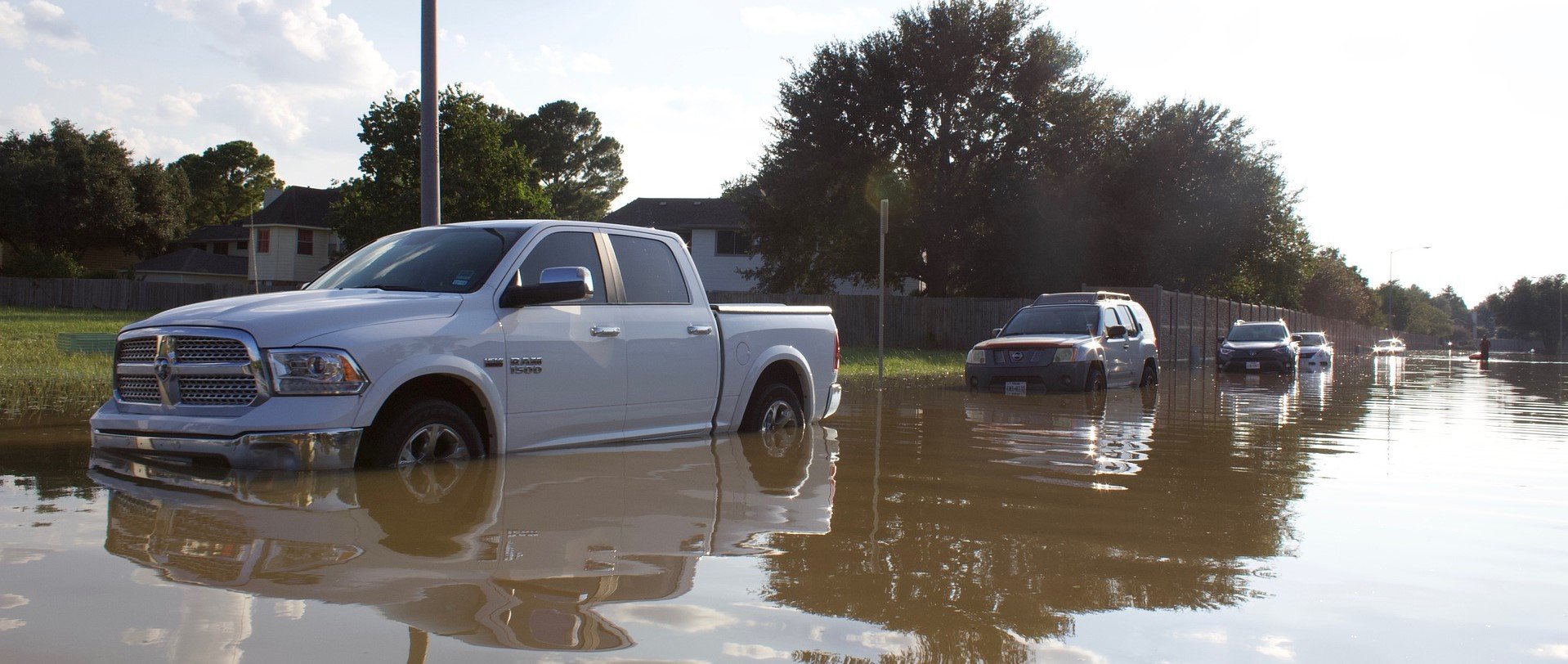 Flooded Cars in a Street - VeteranCarDonations.org