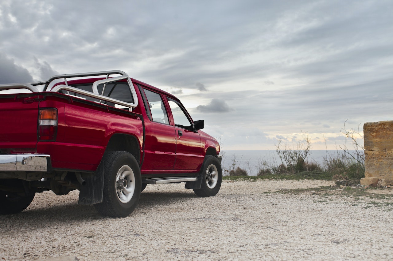 parked Red Pick Up Truck | Veteran Car Donations