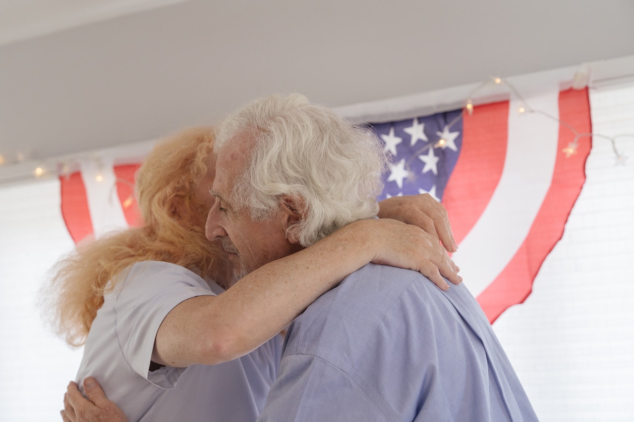 Woman in White T-shirt Lying on Bed | Veteran Car Donations
