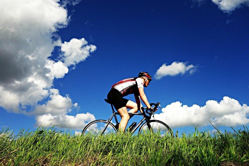 Man Biking on a Bright Weather - VeteranCarDonations.org