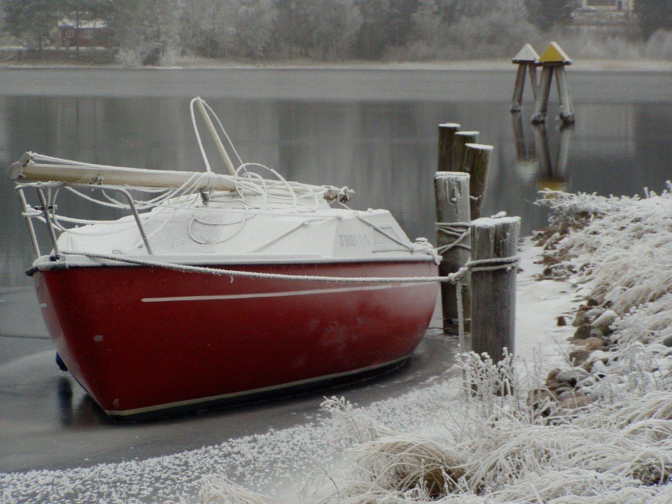 Boat Sitting on an Icy Cold Waters - VeteranCarDonations.org