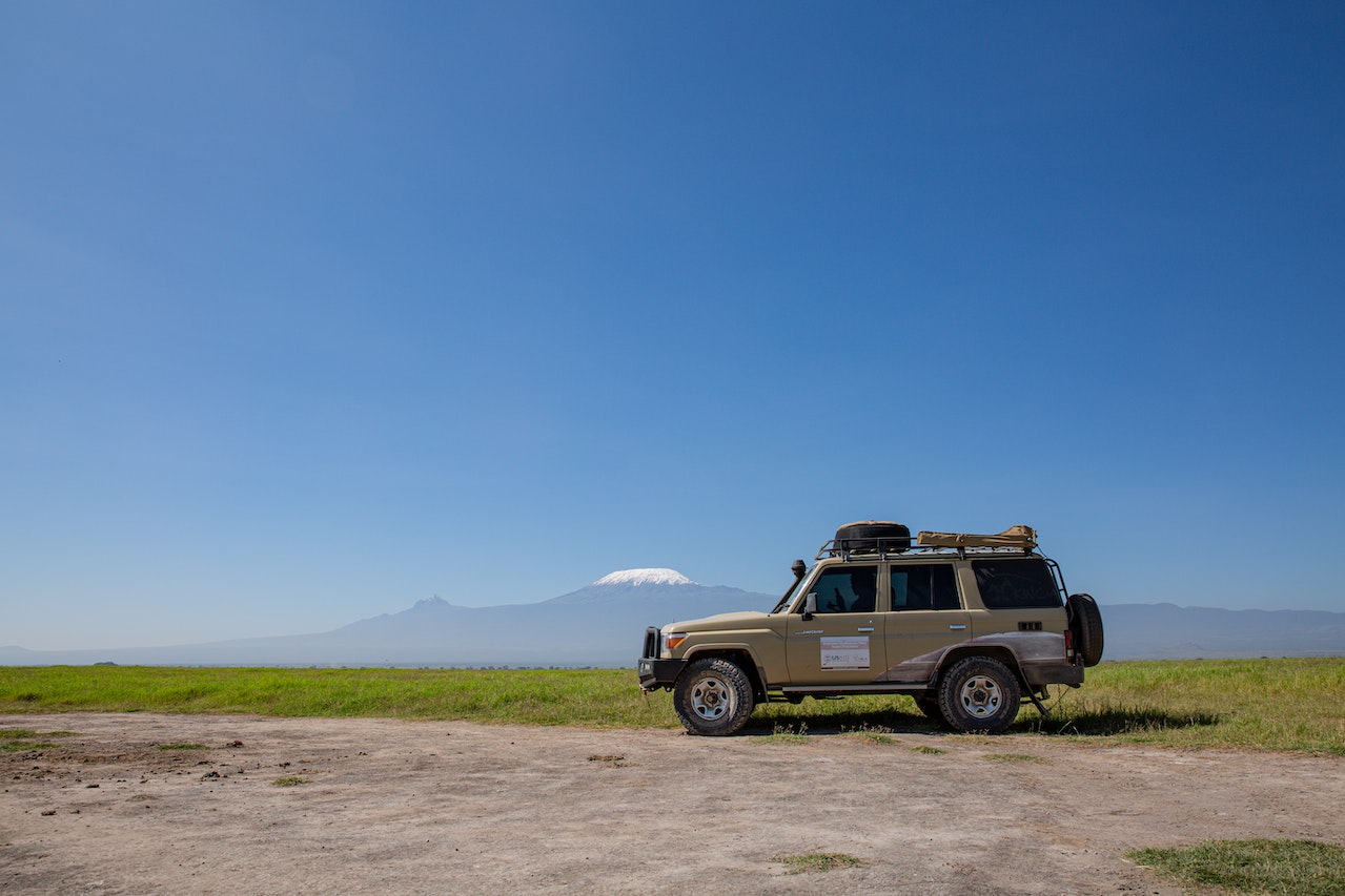 Brown Vehicle Parked on Grassland | Veteran Car Donations
