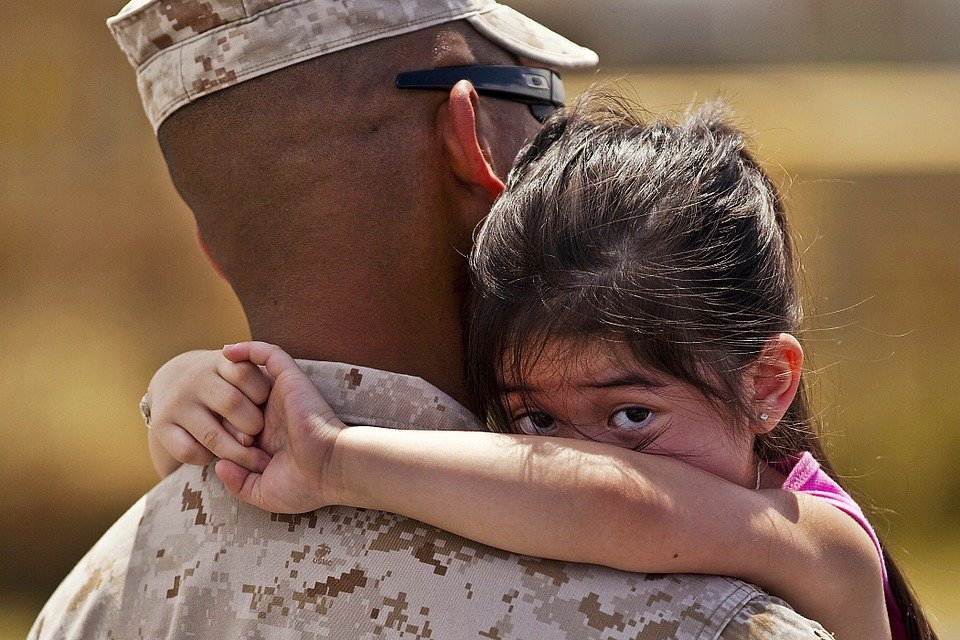 Military Man and a Child - VeteranCarDonations.org