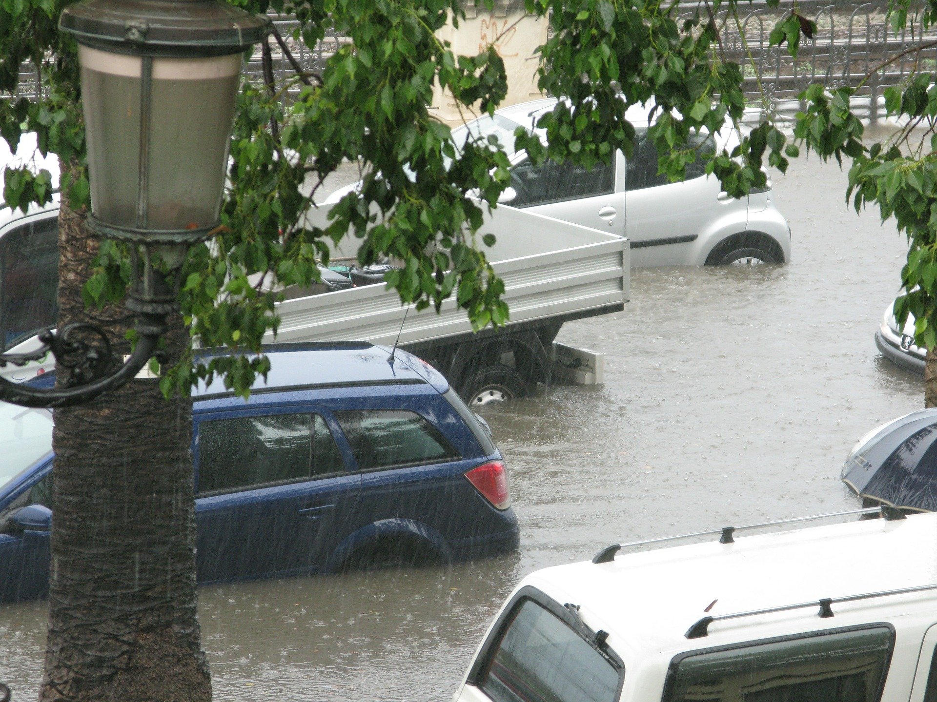 Flooded Vehicles on a Street - VeteranCarDonations.org