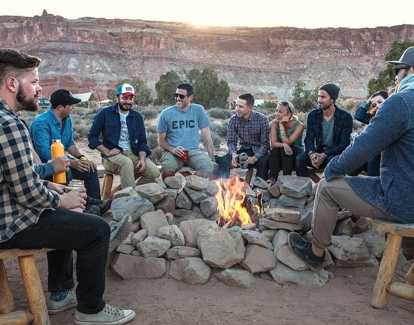Happy People on a Campfire - VeteranCarDonations.org