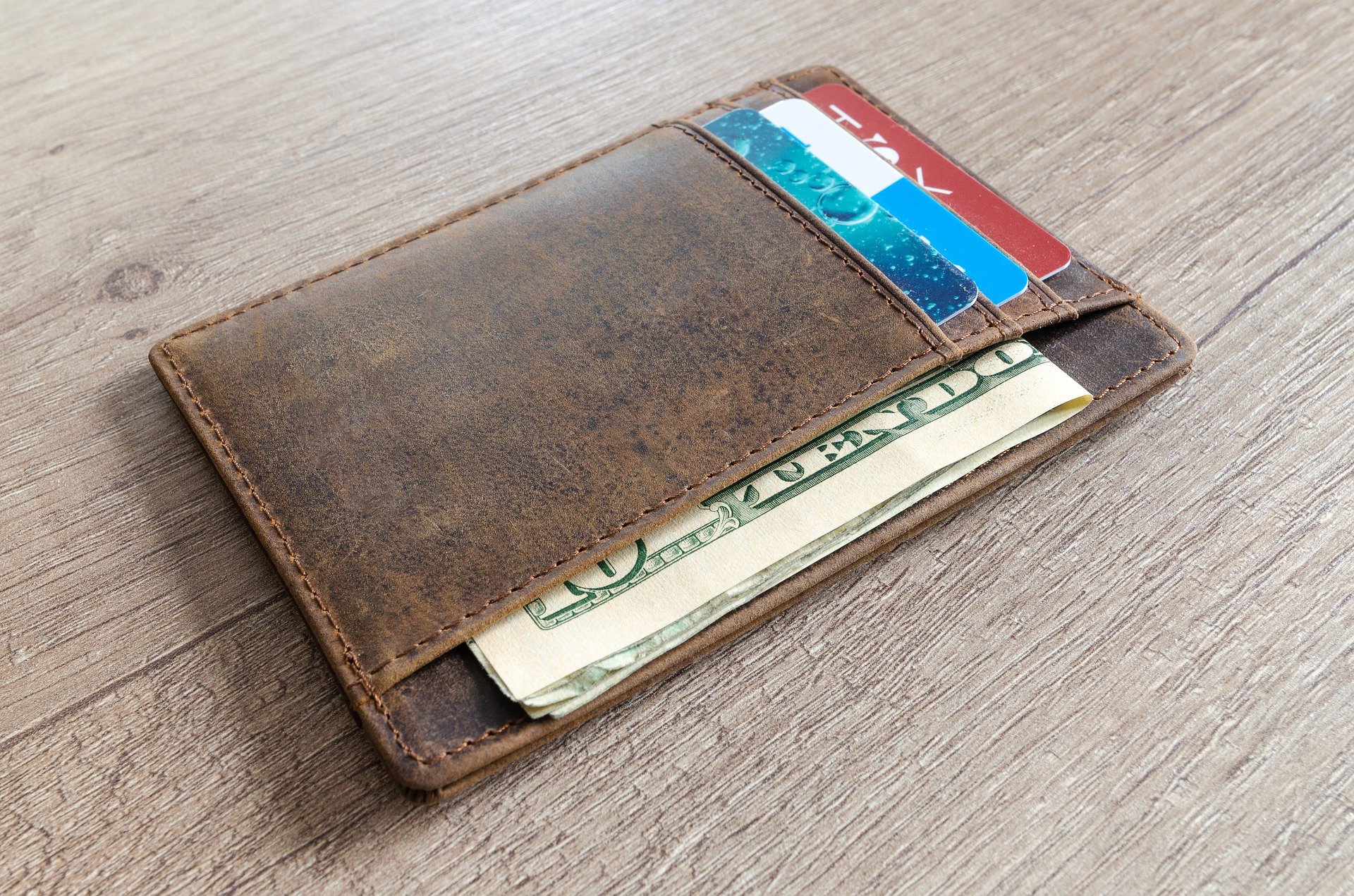 Cash and Card in a Wallet - VeteranCarDonations.org