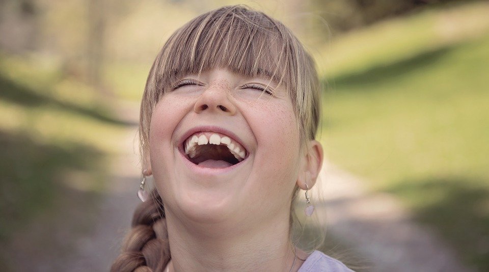 Little Girl Laughing Out Loud - VeteranCarDonations.org