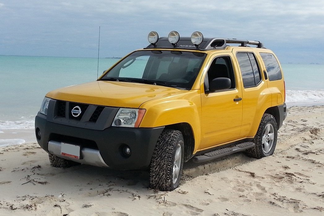 Yellow Nissan Xterra at a Beach - VeteranCarDonations.org