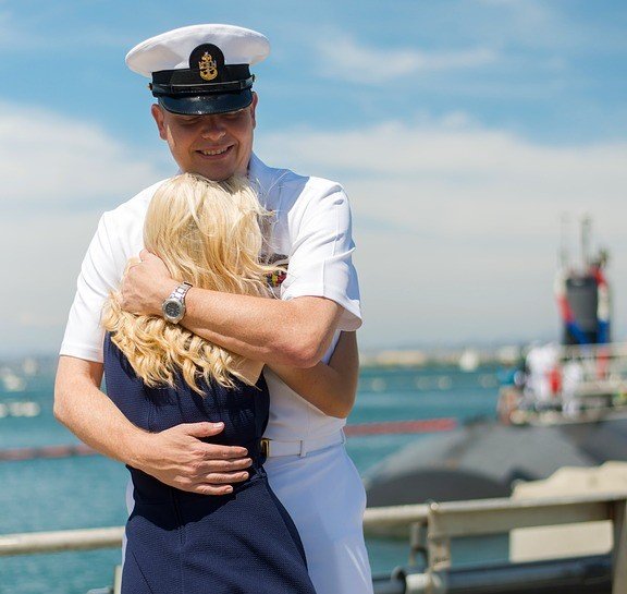Wife Welcoming Back his Military Husband - VeteranCarDonations.org