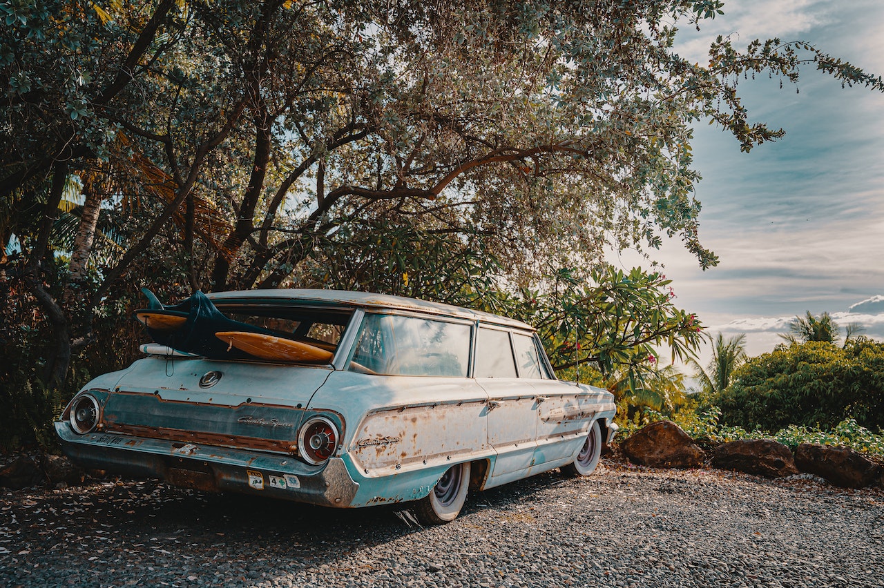 Surfboards Inside Vintage Light Blue Station Wagon | Veteran Car Donations
