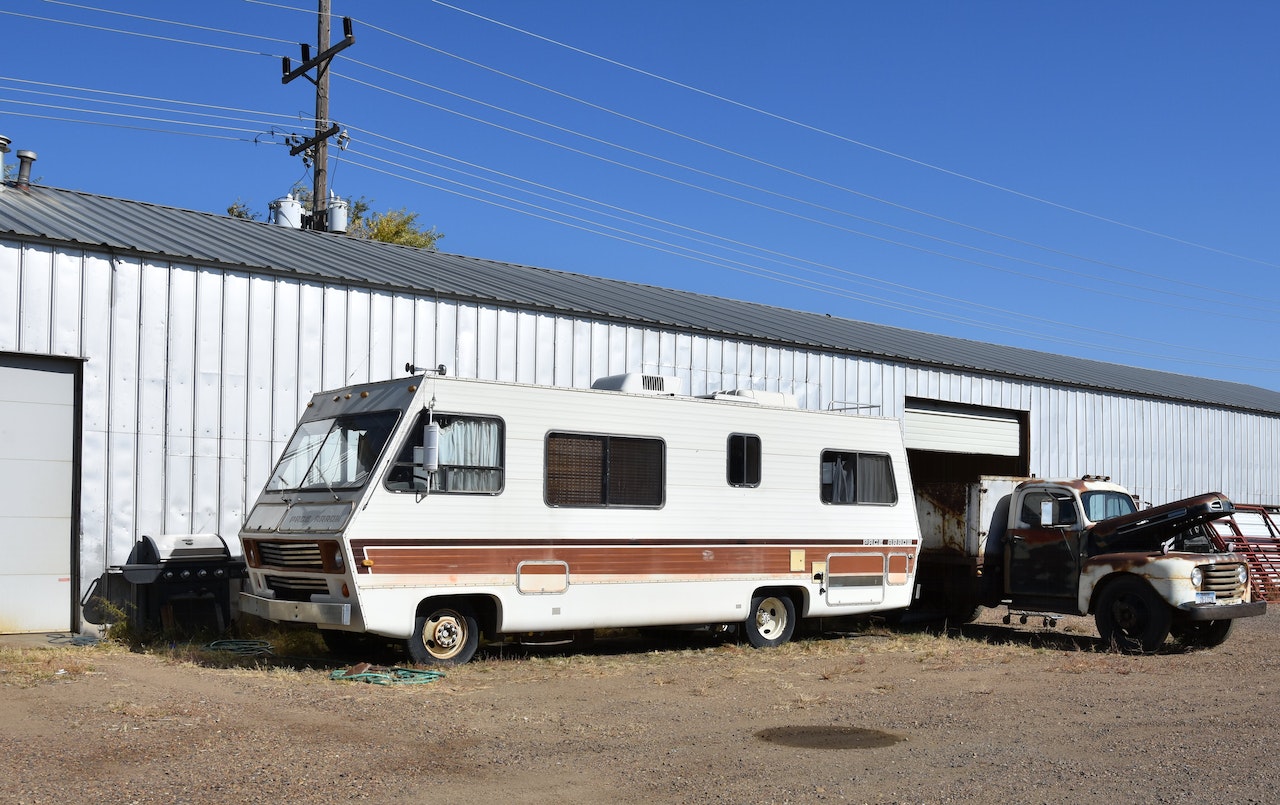 Vintage Mobile RV Parked on Dirt Road | Veteran Car Donations