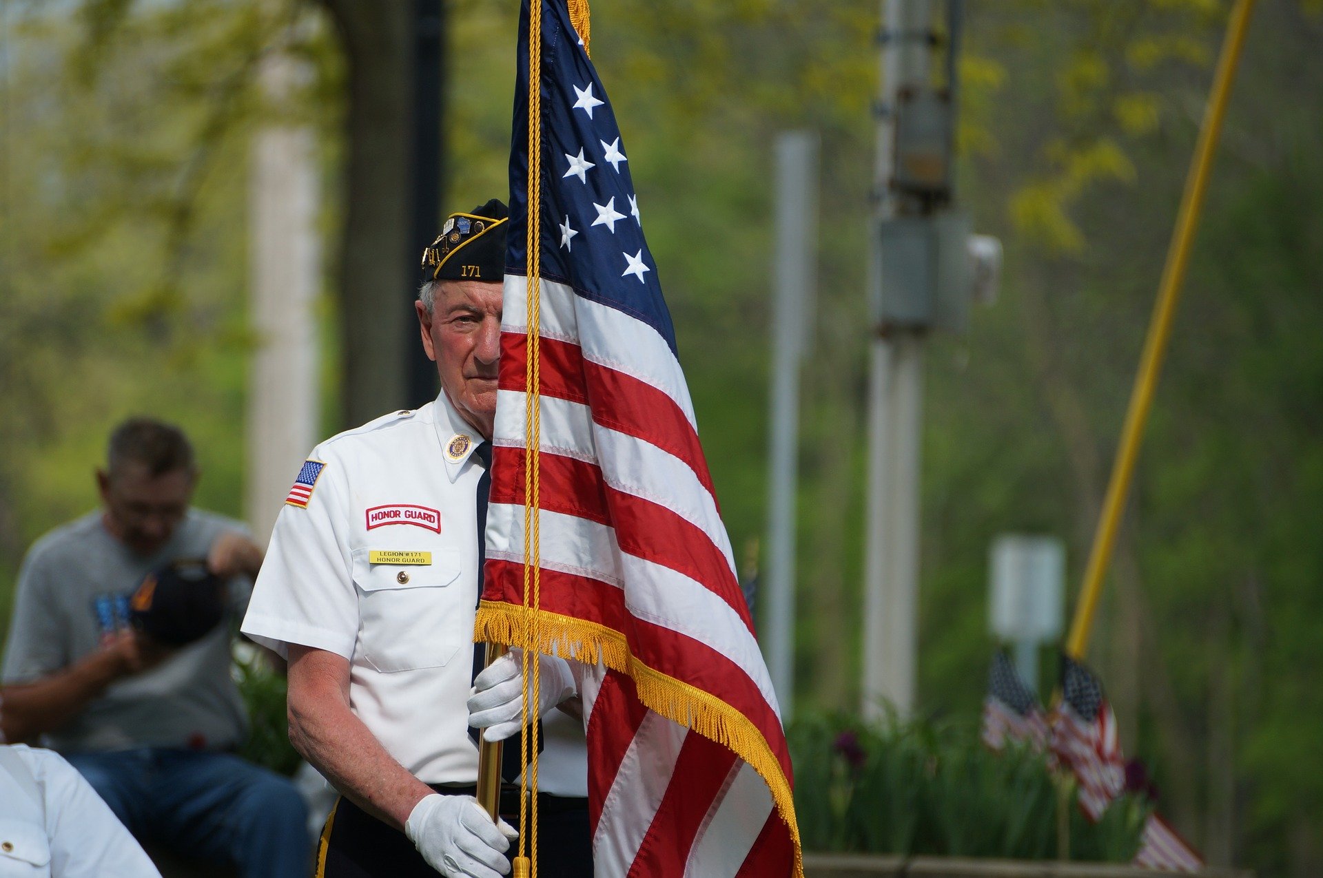 Veteran Holding the American Flag - VeteranCarDonations.org