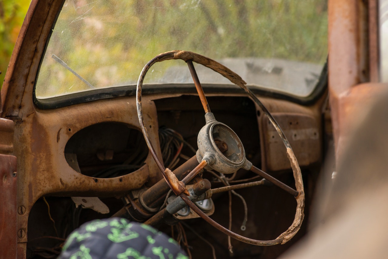 An Abandoned Car with Broken Steering Wheel | Veteran Car Donations
