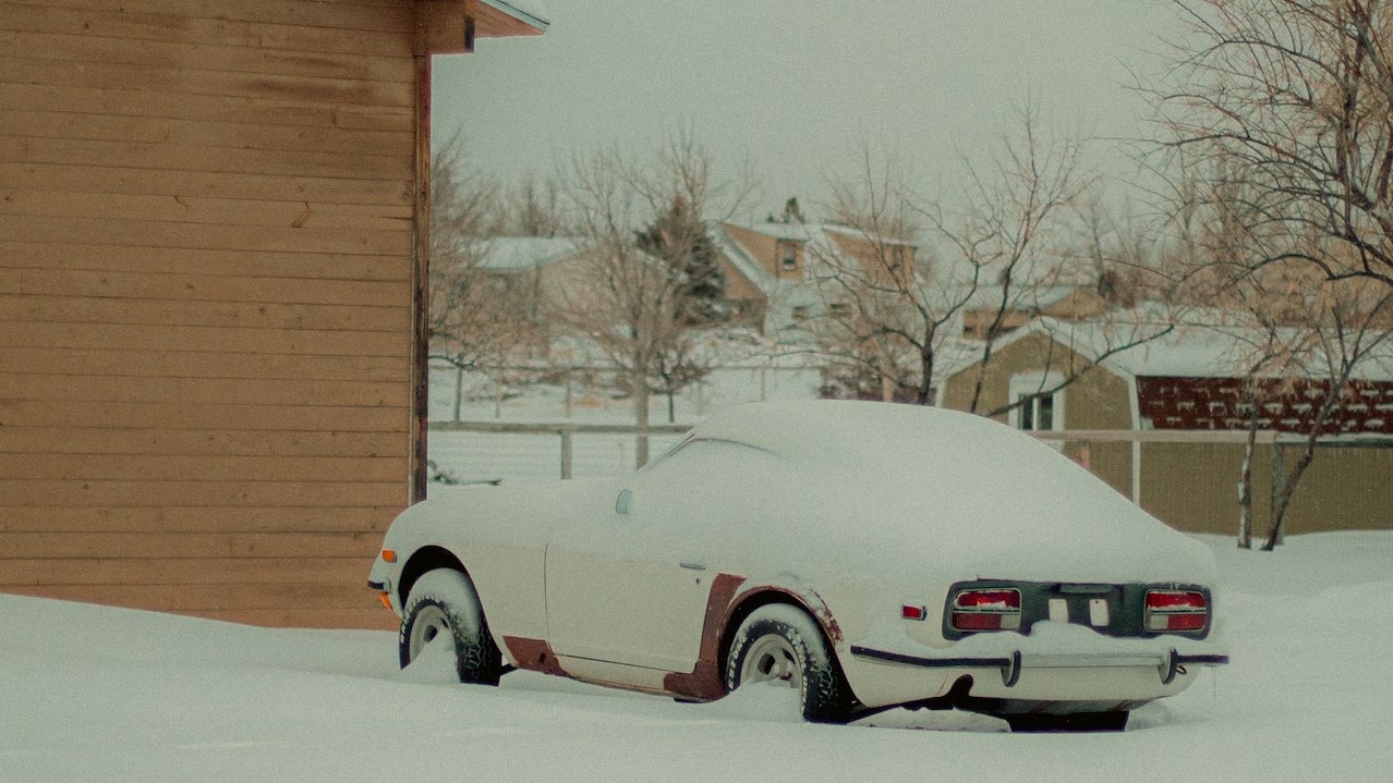 Car Cover in Snow | Veteran Car Donations