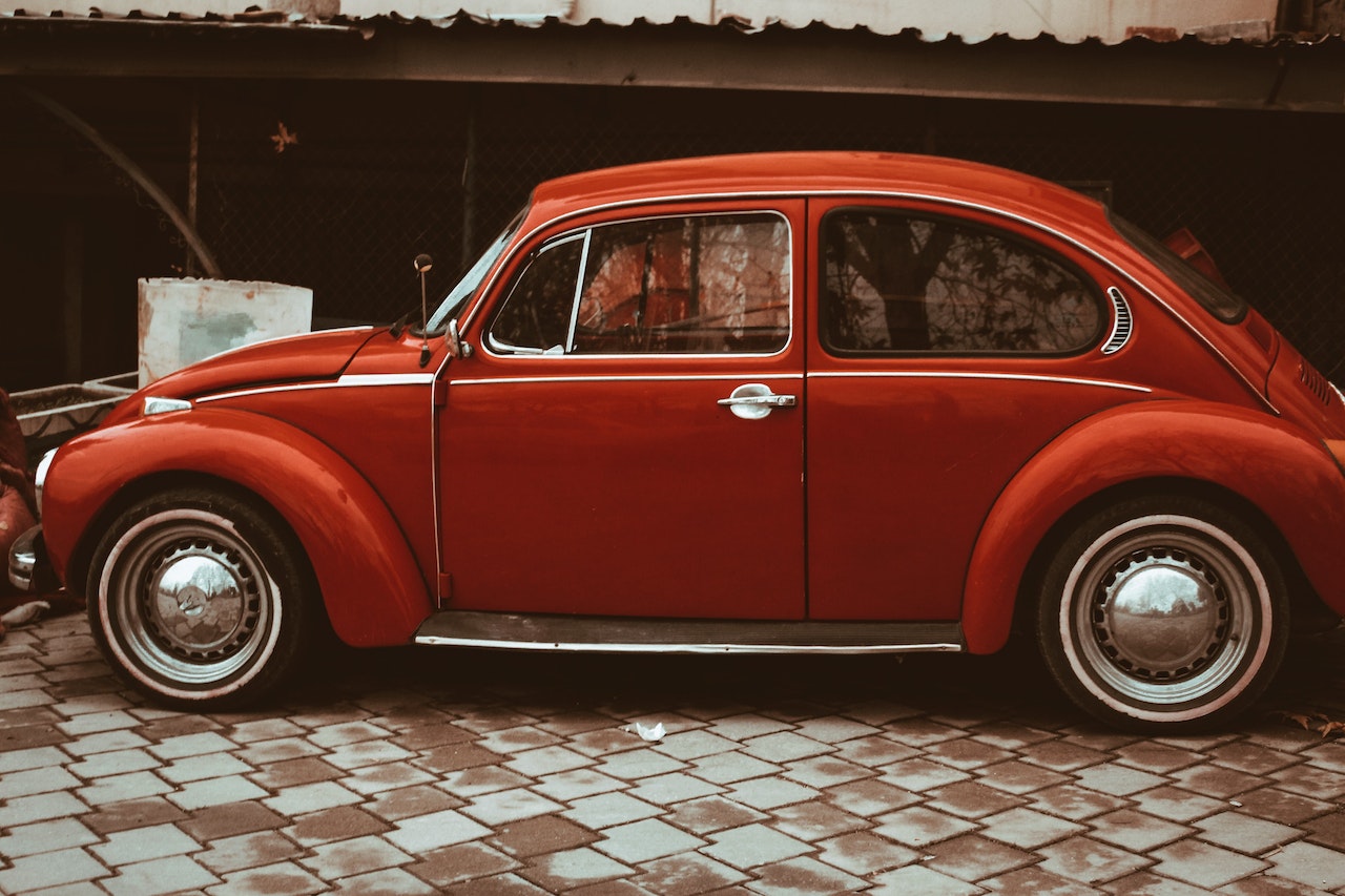 Retro car parked in courtyard near garage | Veteran Car Donations
