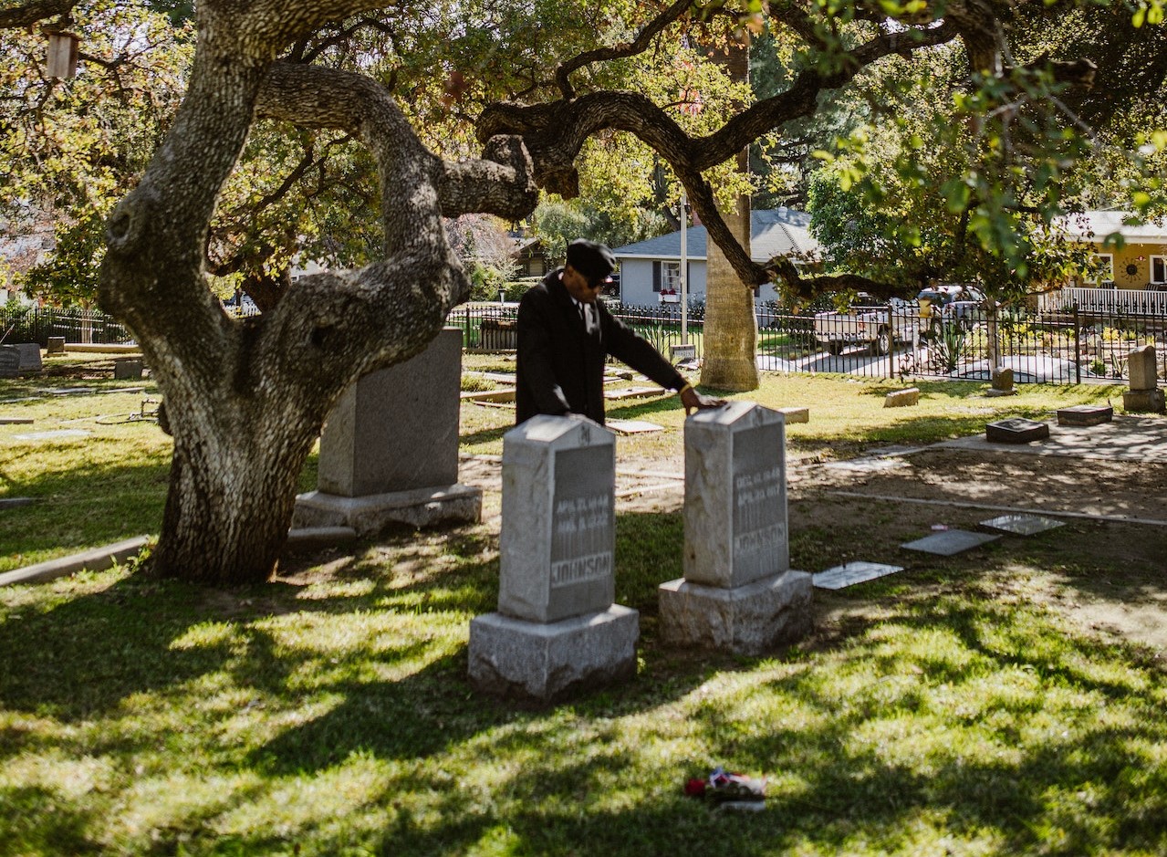 Elderly Man grieves in front of a Tomb | Veteran Car Donations