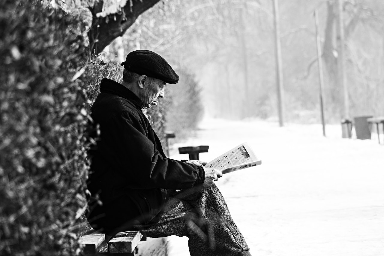 Man Sitting on Bench | Veteran Car Donations
