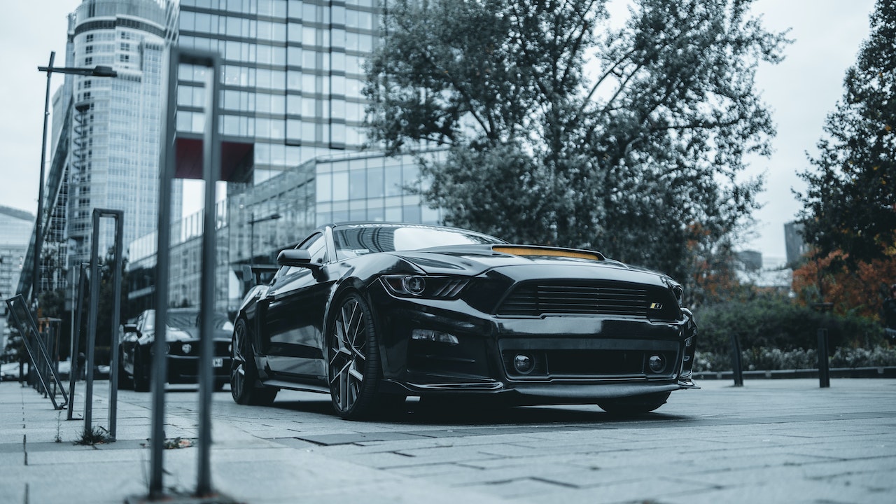 Black Ford Mustang Parked on the Street | Veteran Car Donations 