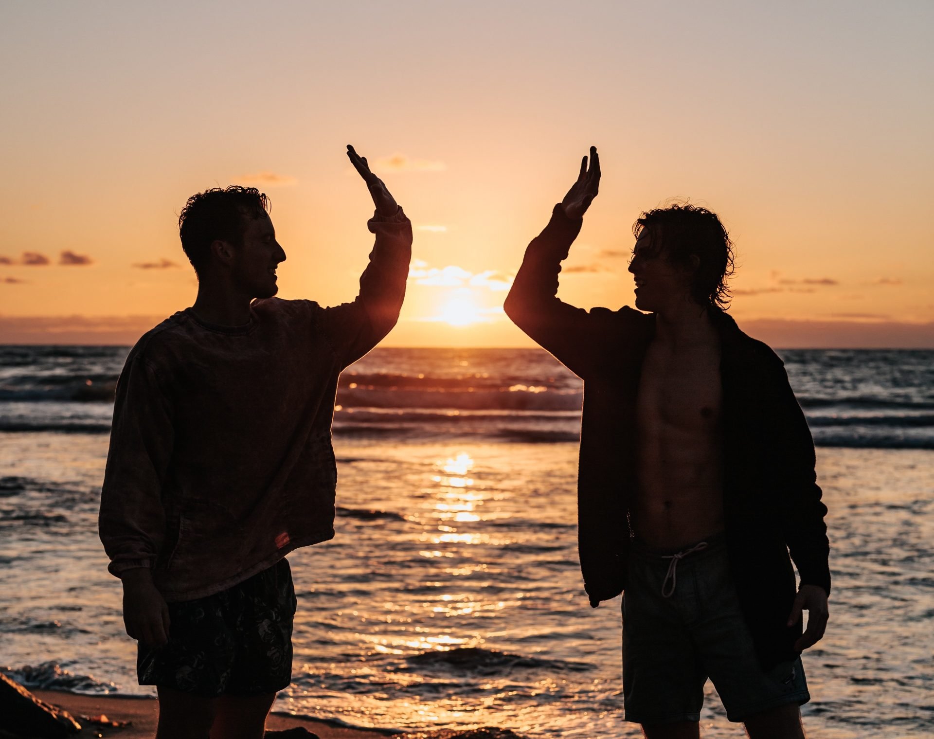 High Five on a Beach | Veteran Car Donations