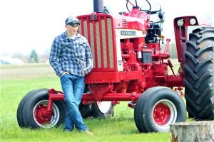Man on a Farm with a Tractor | Veteran Car Donations