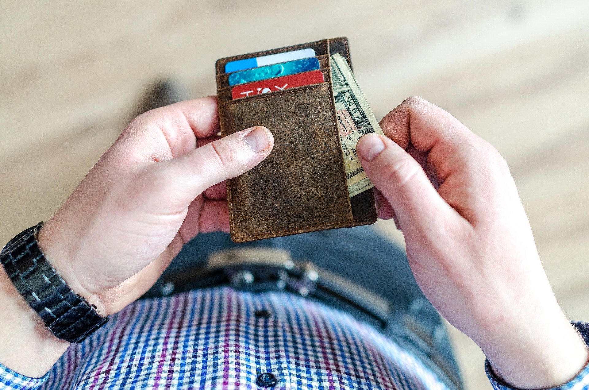 Man Checking his Wallet | Veteran Car Donations