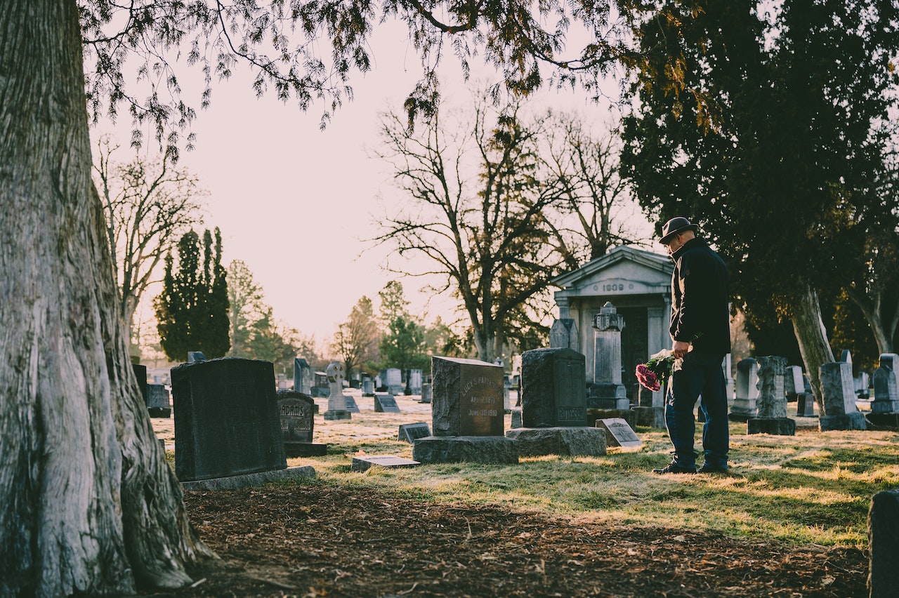 Standing in Front of Grave | Veteran Car Donations