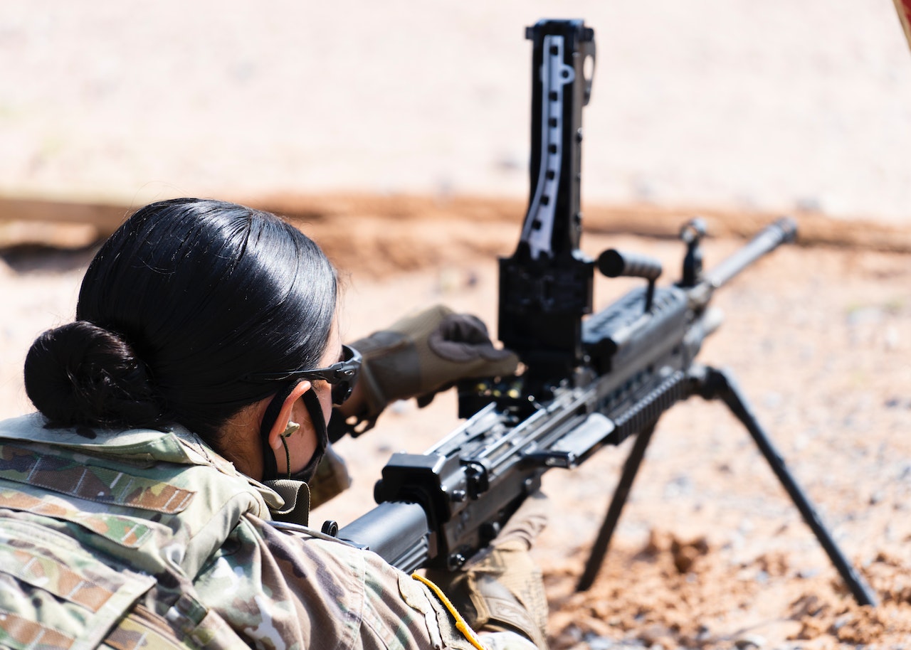 A Woman Using a Machine Gun | Veteran Car Donations