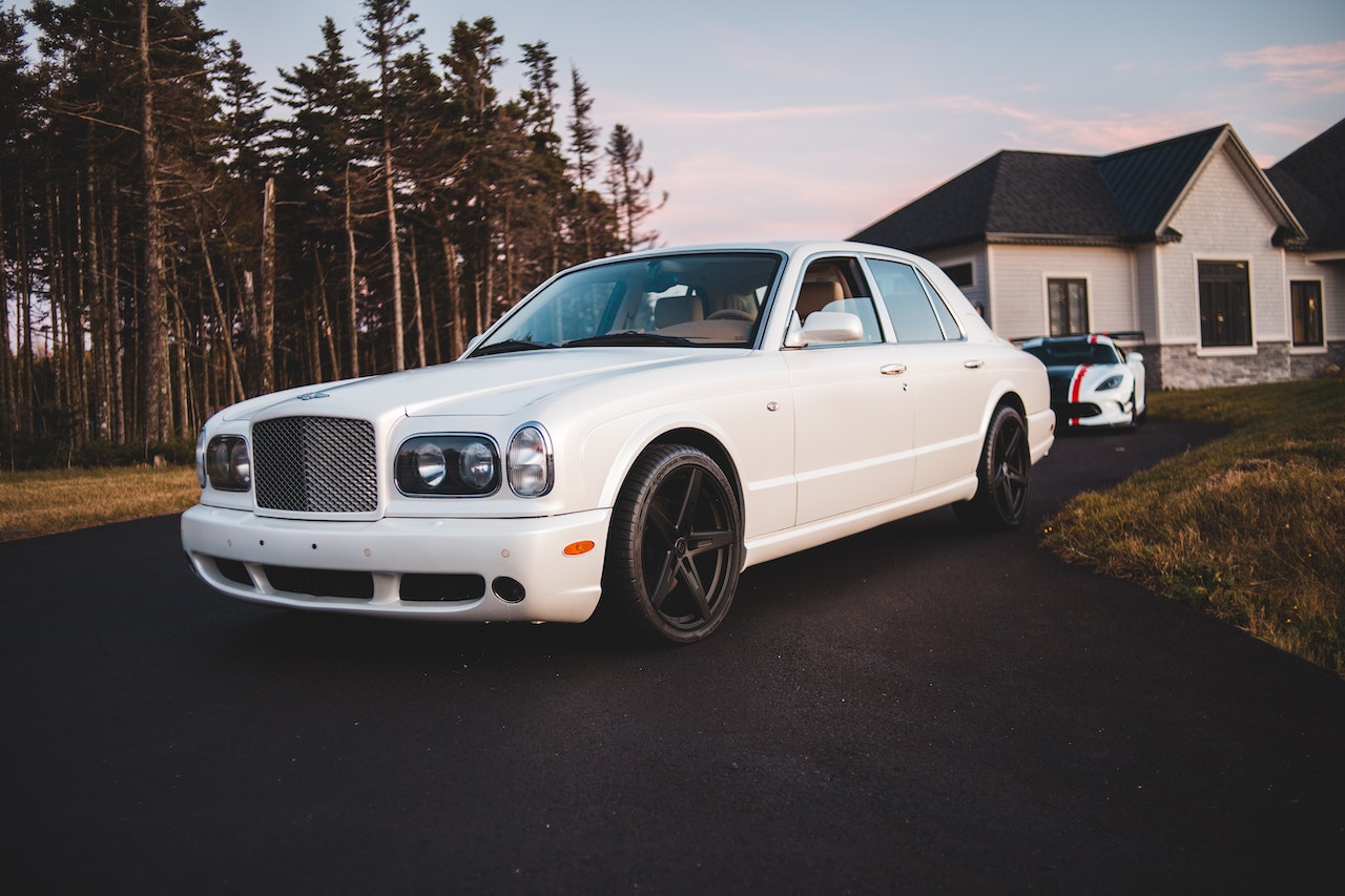 White Car Parked Near Green Trees | Veteran Car Donations