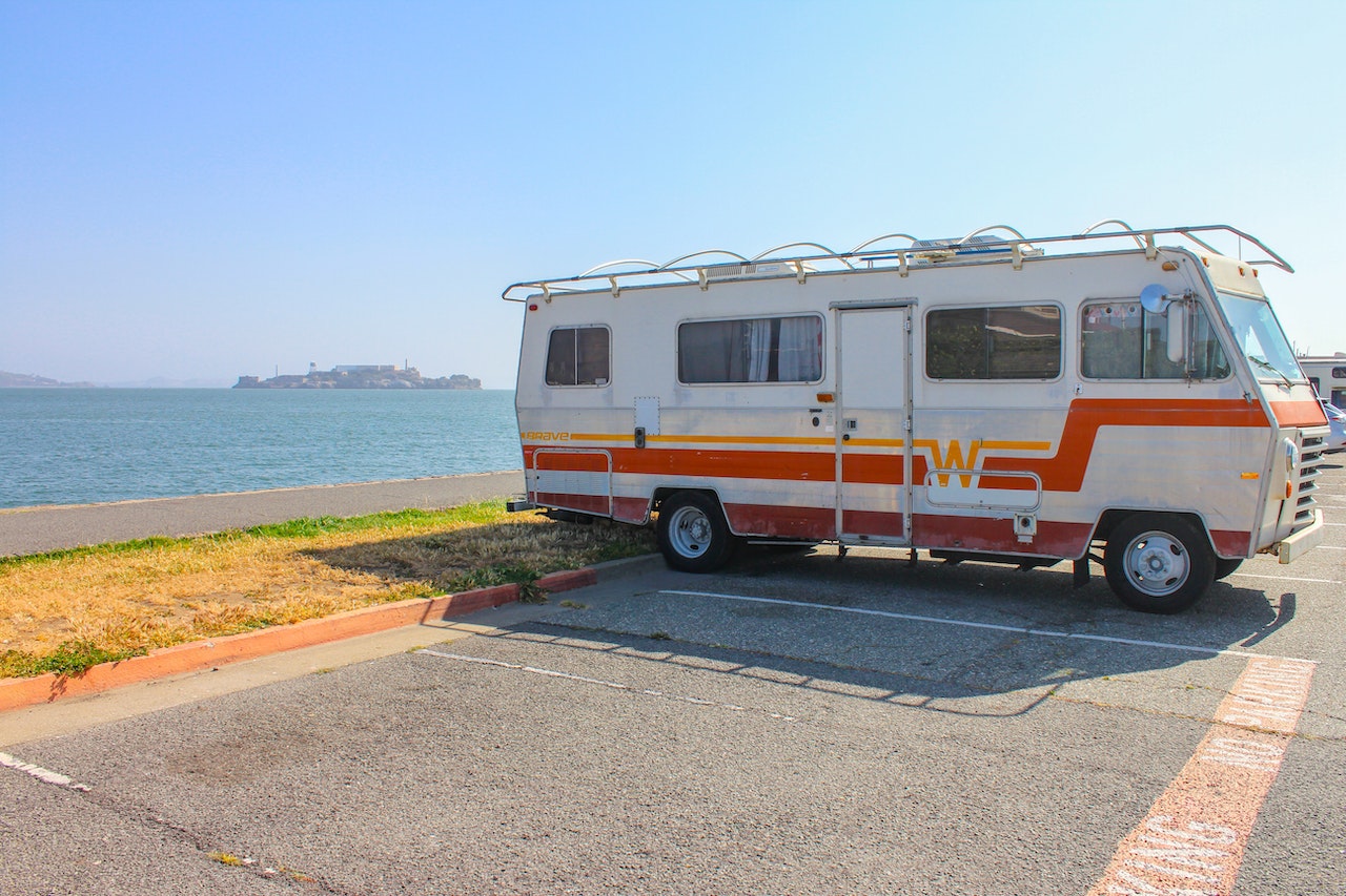 Orange Winniebago parked | Veteran Car Donations