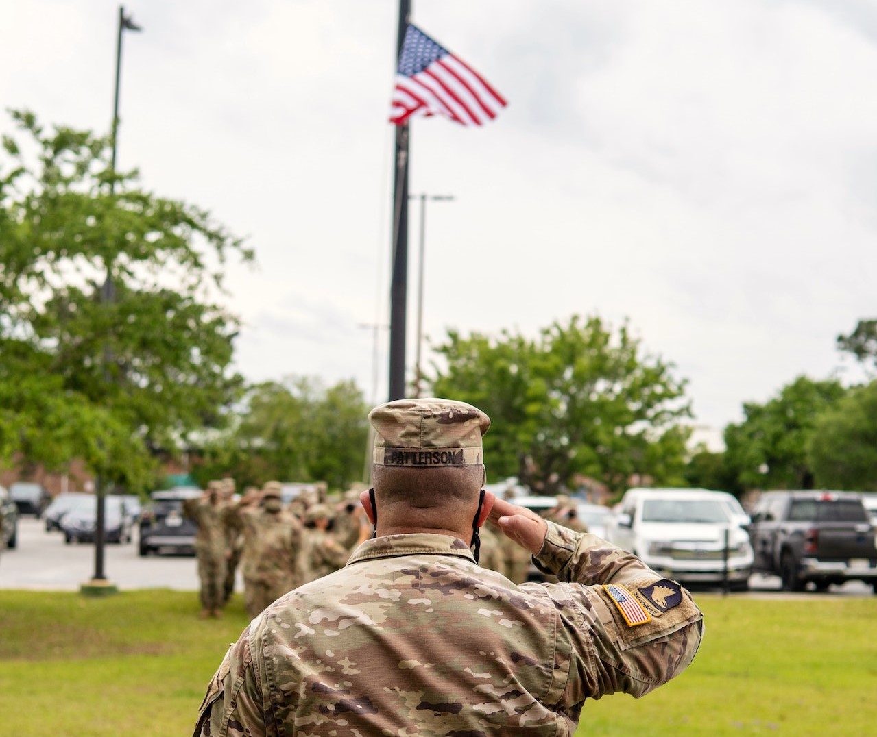 Soldier Saluting During Flag Ceremony | Veteran Car Donations