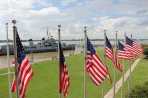 Military Ship and American Flags | Veteran Car Donations