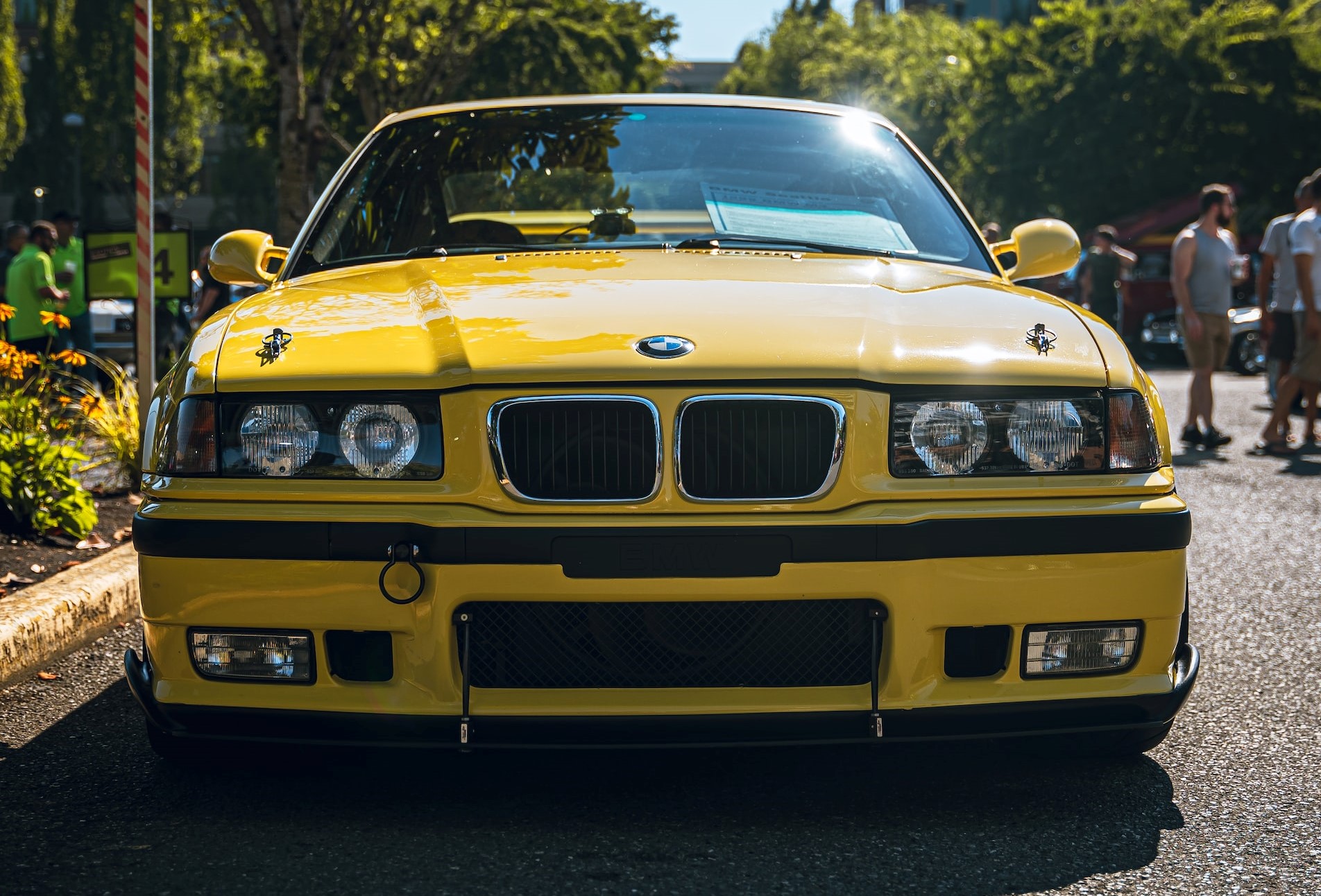 Yellow BMW parked on the Street | Veteran Car Donations