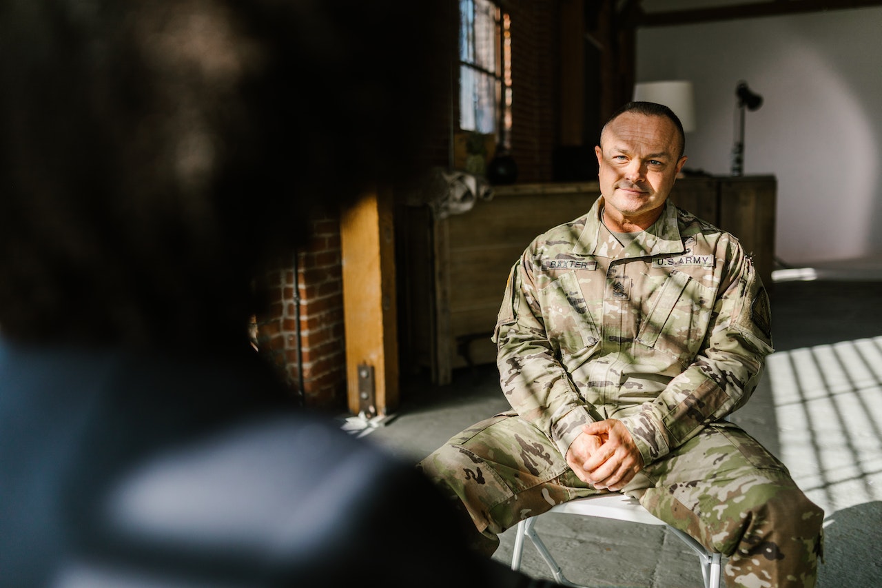 Photo of Soldier Listening to a Psychologist | Veteran Car Donations