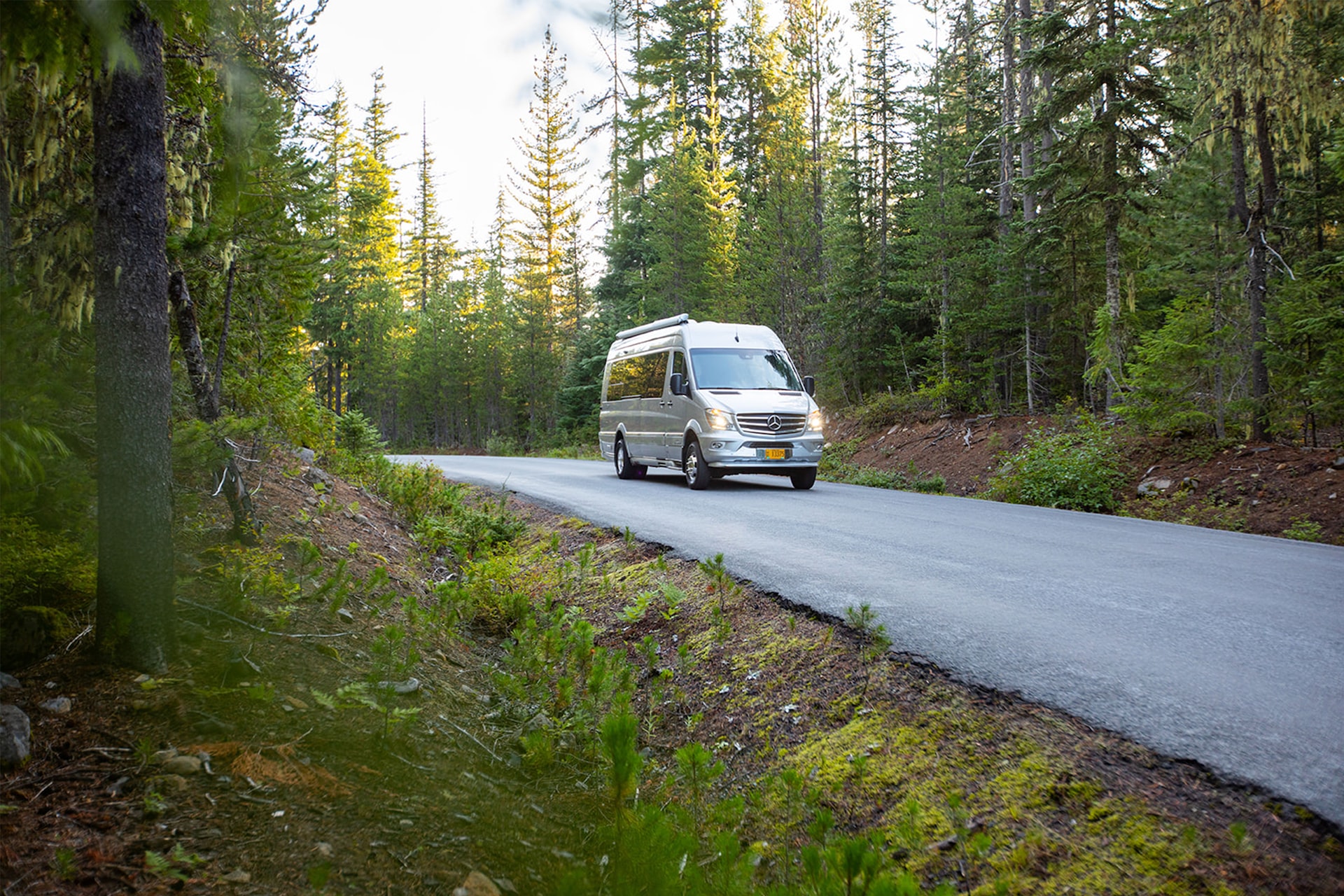 White RV on road | Veteran Car Donations