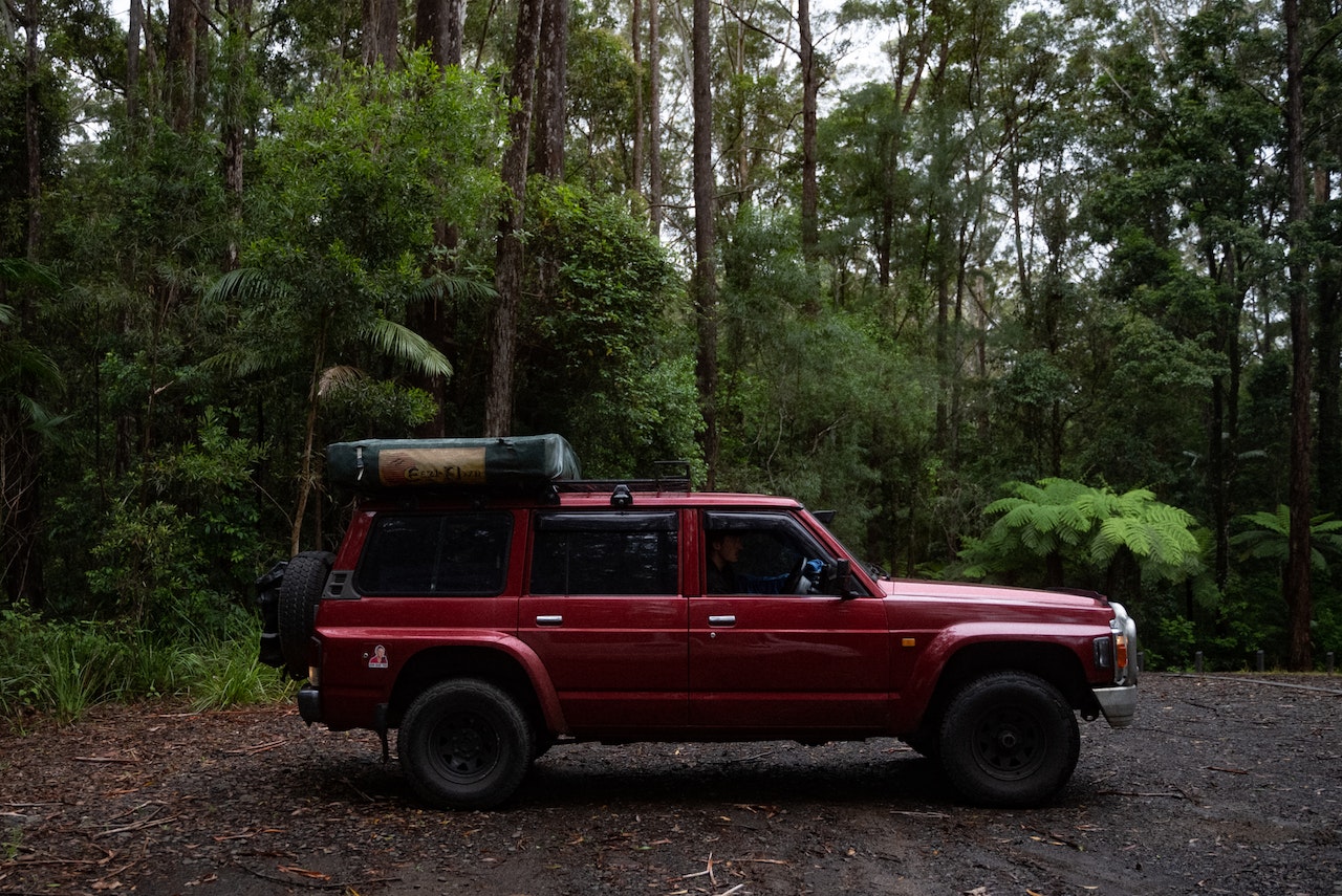 A Man on a Red SUV | Veteran Car Donations