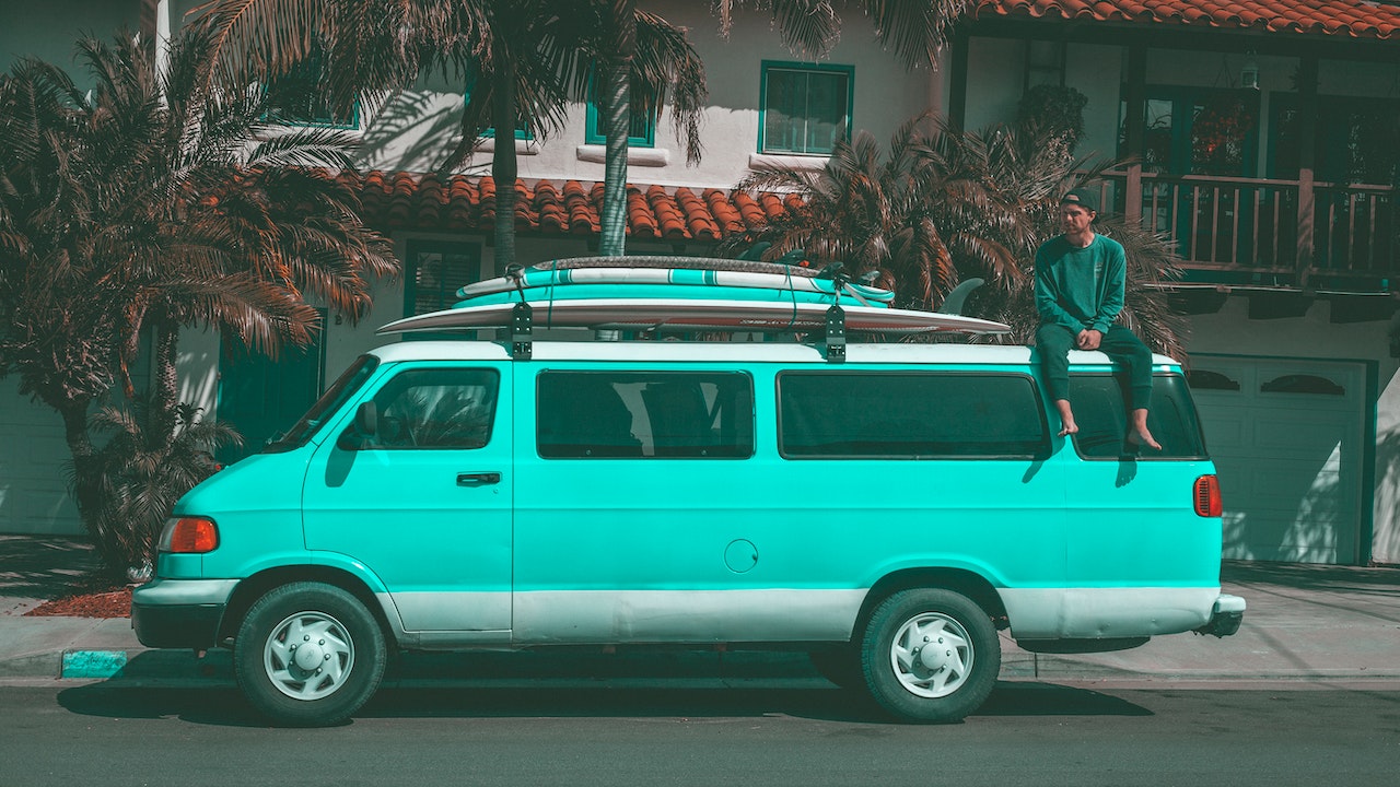 A man sitting on top of a van | Veteran Car Donations