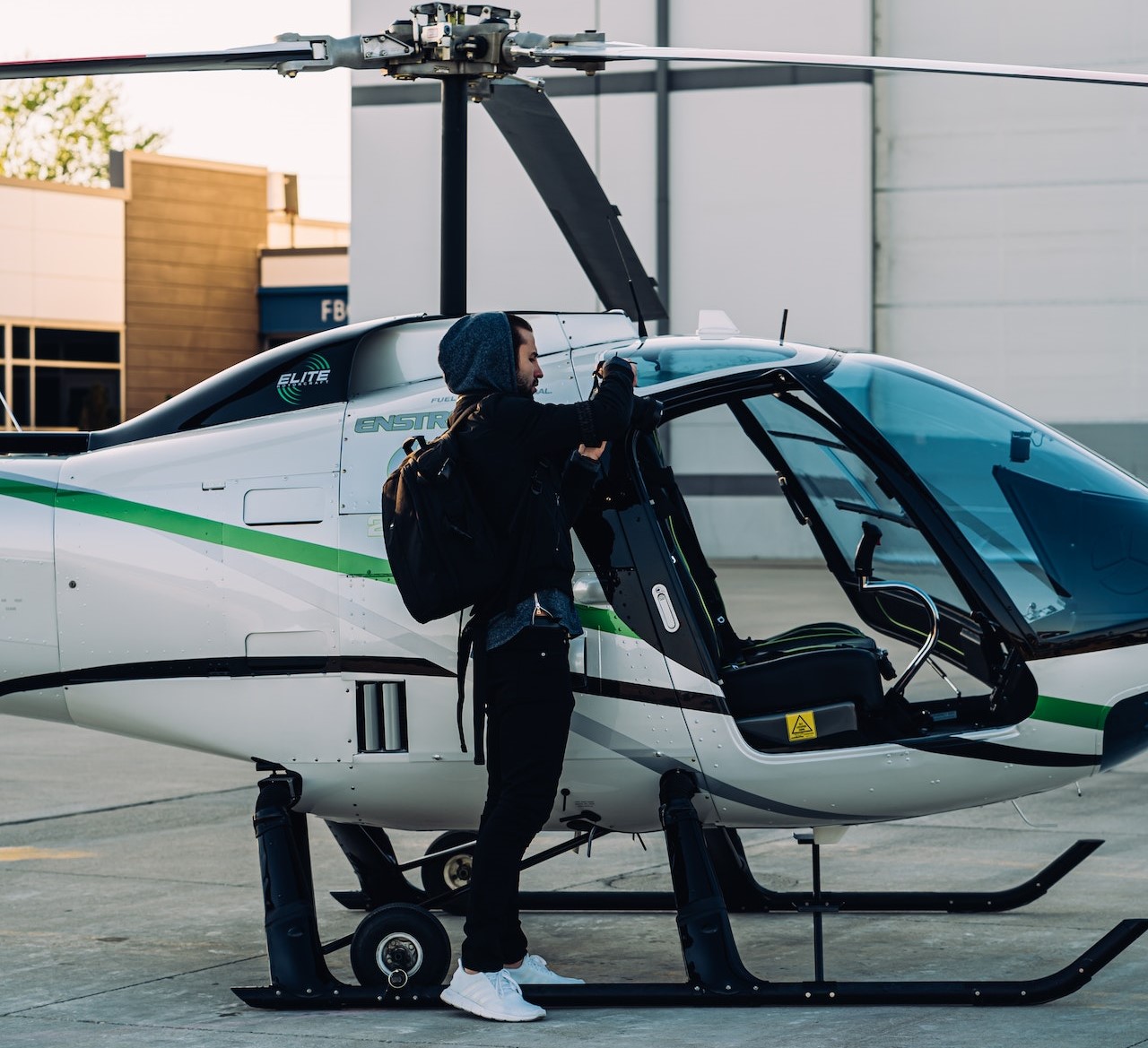 Person Standing Beside White Helicopter | Veteran Car Donations