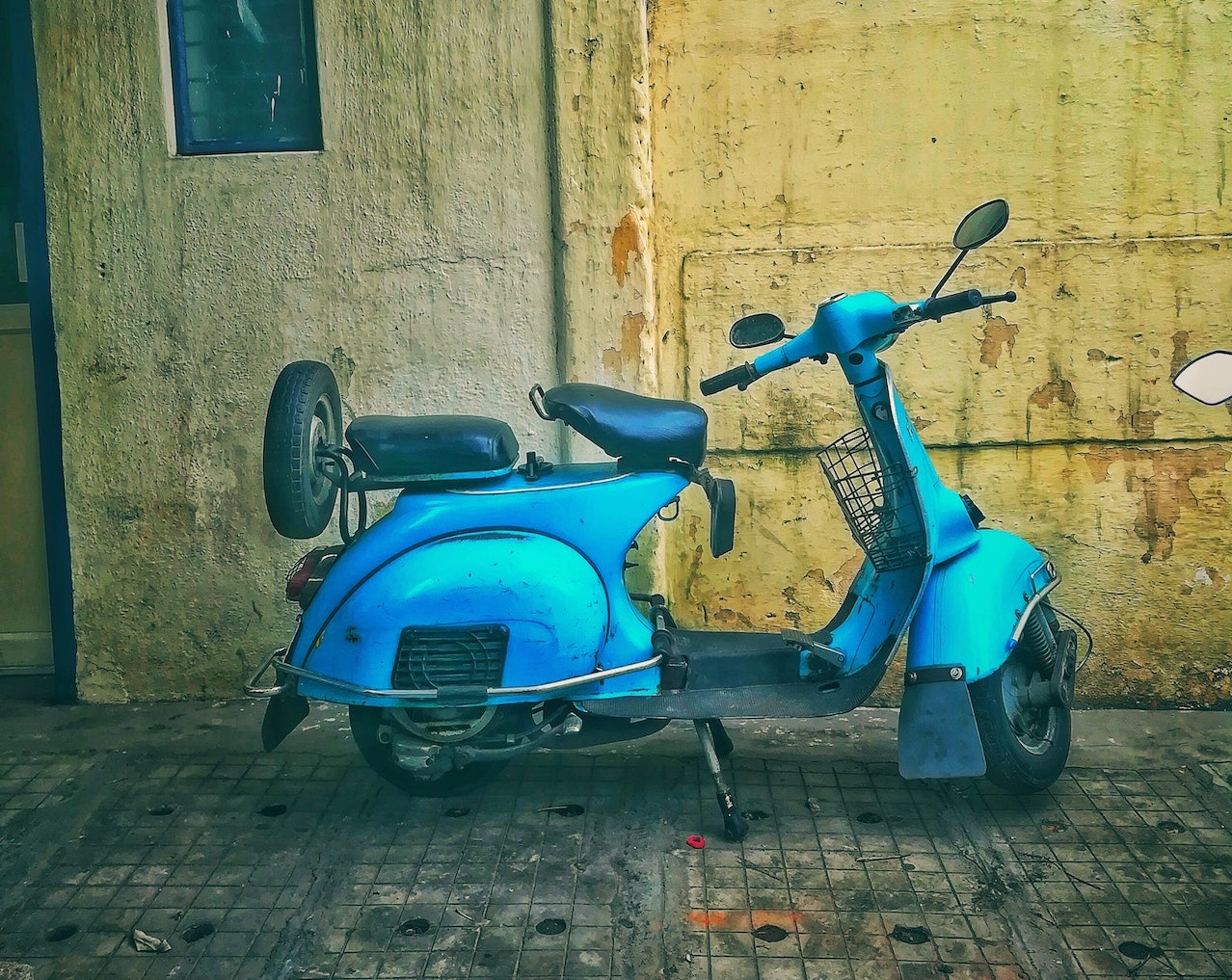 Teal Scooter on Road | Veteran Car Donations