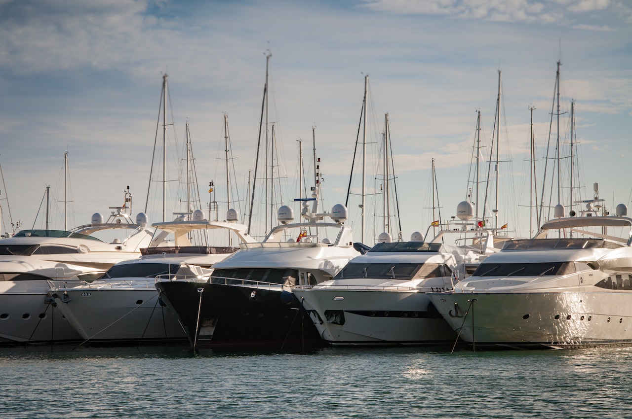 A group of yacht docked | Veteran Car Donations