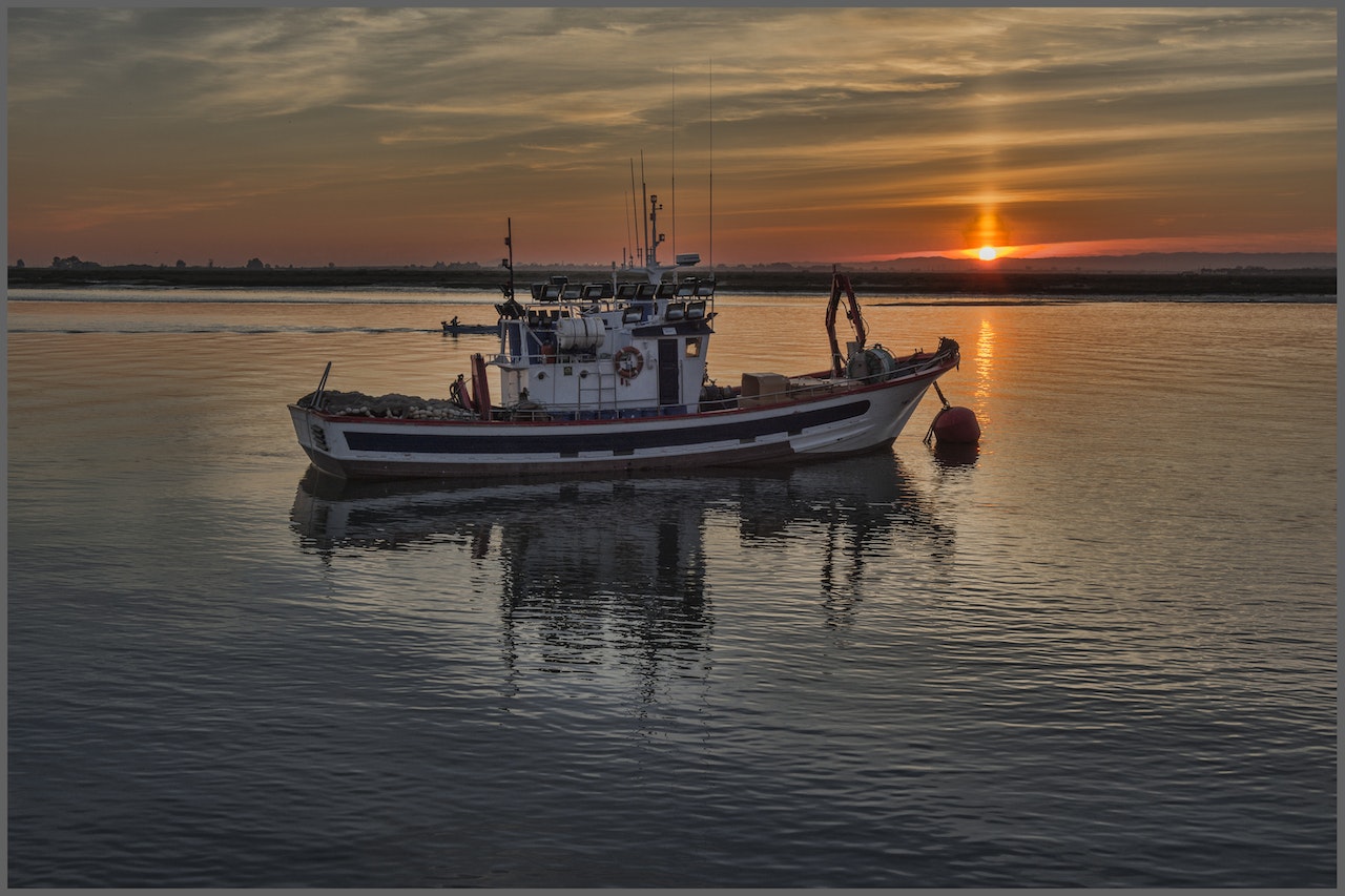 Boat on Body of Water during Day Time | Veteran Car Donations