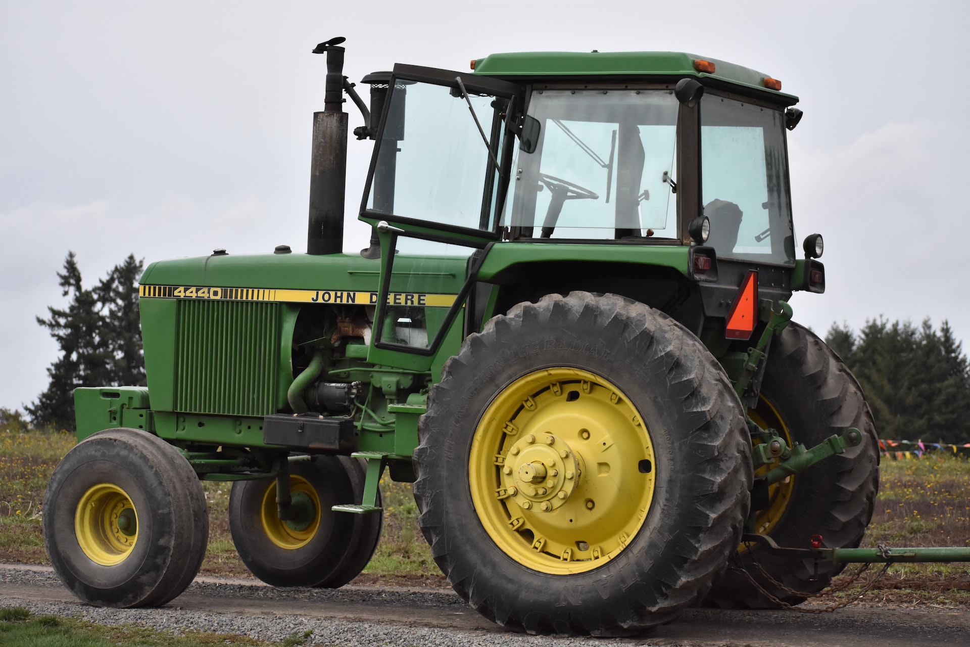 green tractor on brown soil | Veteran Car Donations