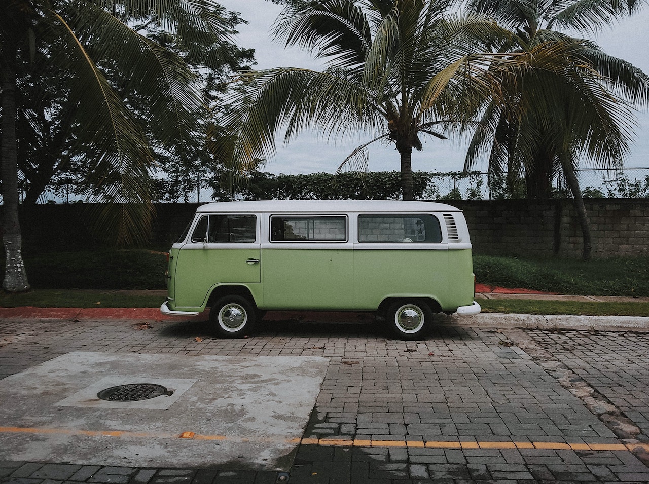 Green Volkswagen Transporter Van Parked Under Coconut Trees | Veteran Car Donations