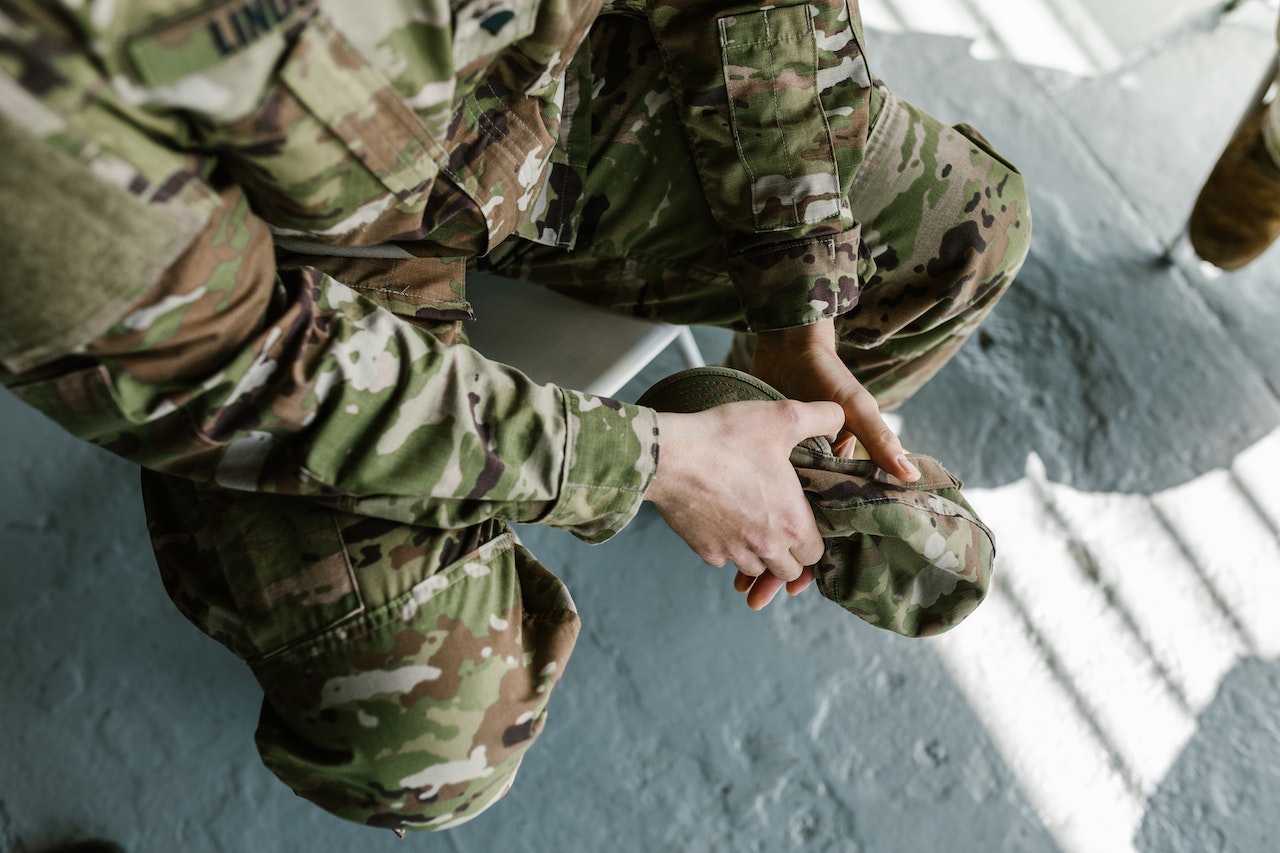 Photo of Man in Green and Brown Camouflage Uniform | Veteran Car Donations