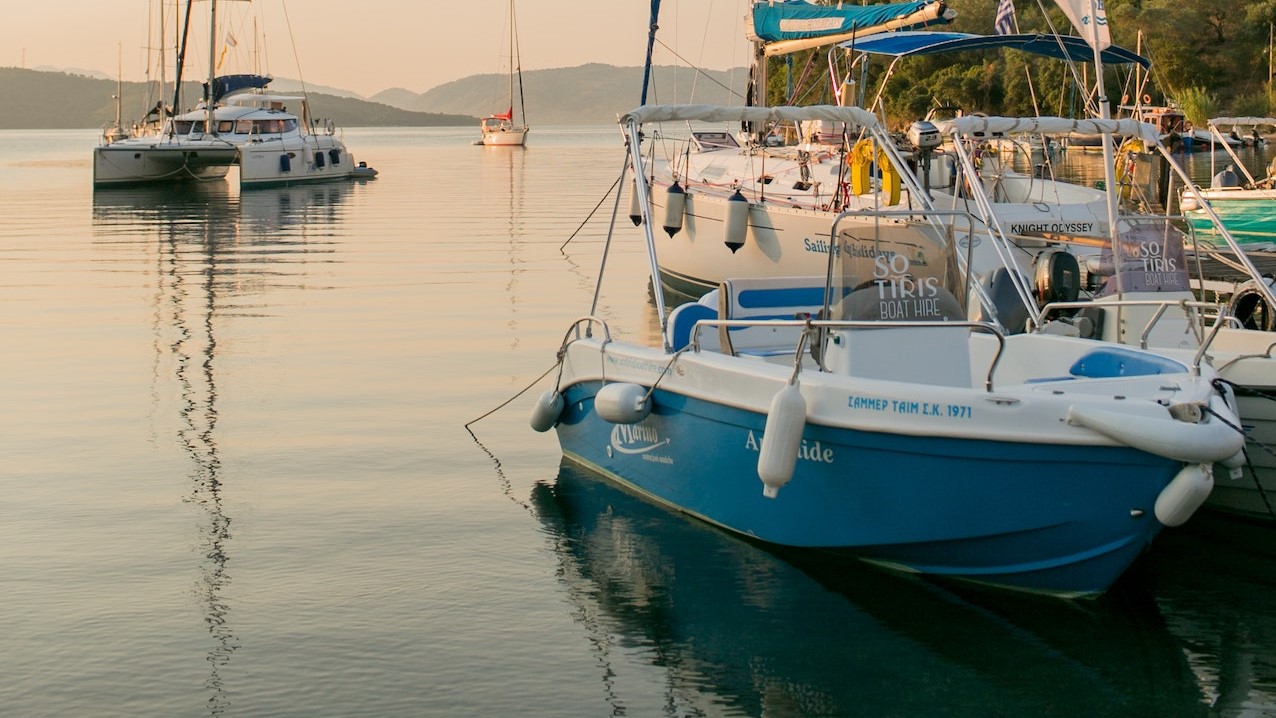 Yachts in peaceful bay of sea | Veteran Car Donations