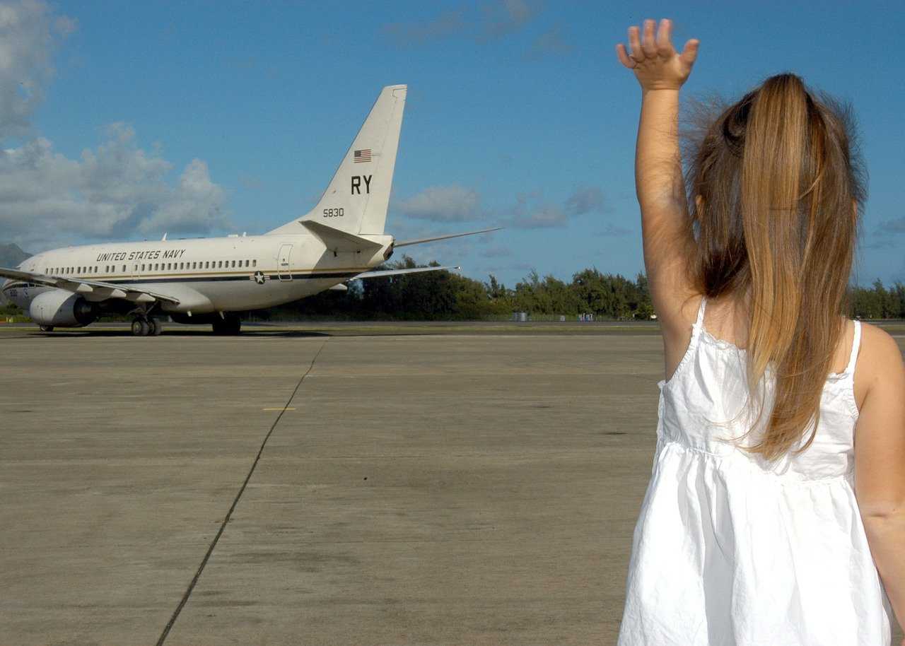 Child Waving Goodbye | Veteran Car Donations
